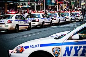 Photograph of NYPD cruisers by SHARPSHOOTA.com on Flickr